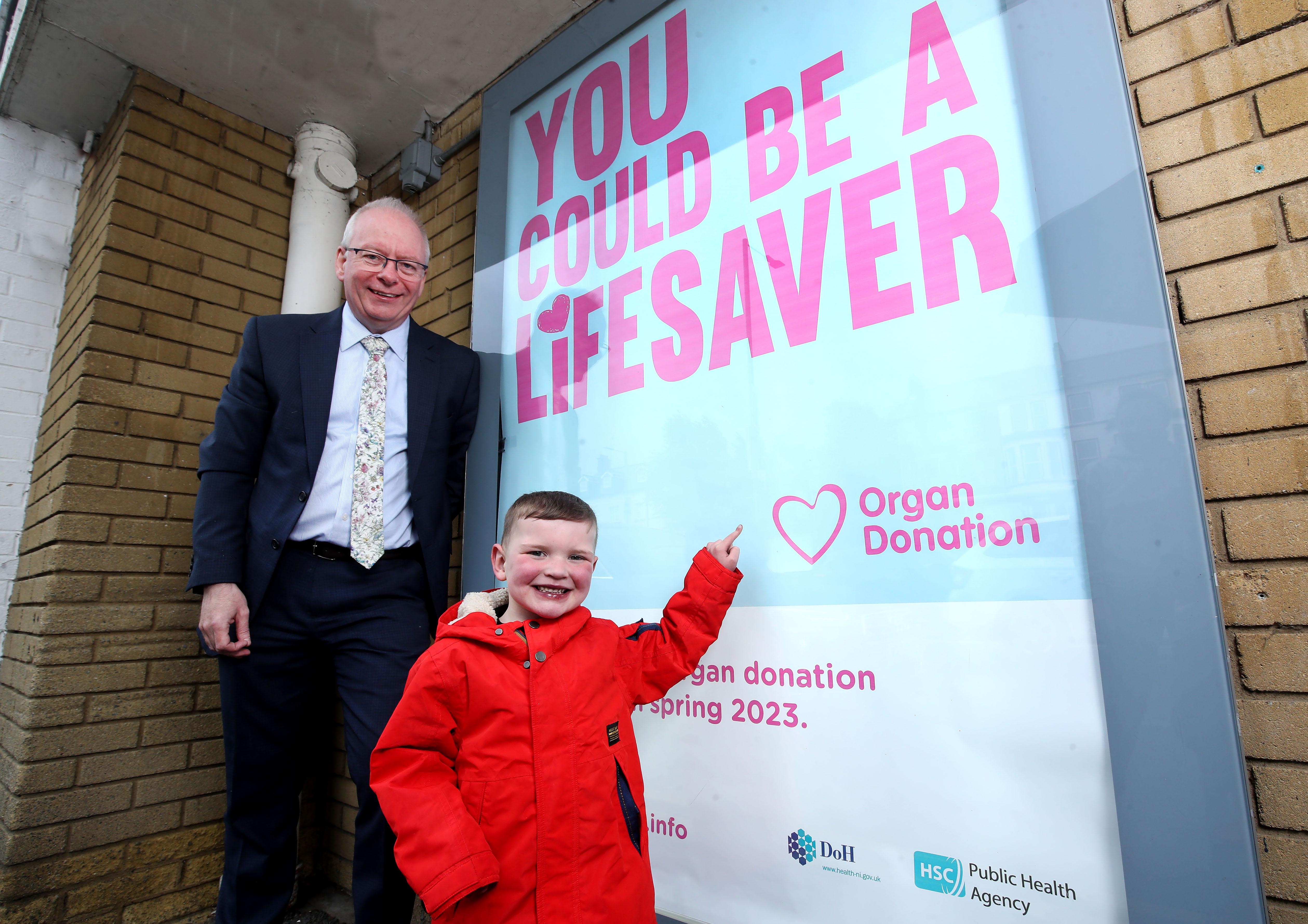 Chief Executive of the PHA Aidan Dawson with 5-year-old organ donation campaigner Dáithí Mac Gabhann at the campaign launch