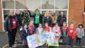 Picture of pupils at Rosetta Primary School with representatives from Public Health Agency, Sustrans, Daily Mile Network, Belfast Health and Social Care Trust and Department for Infrastructure