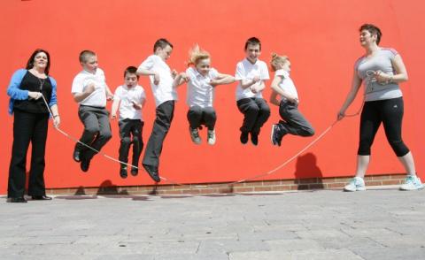 Schoolchildren skipping for health