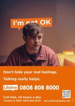 Image of Lifeline poster showing young man and contact details for Lifeline helpline