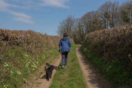A woman walking her dog