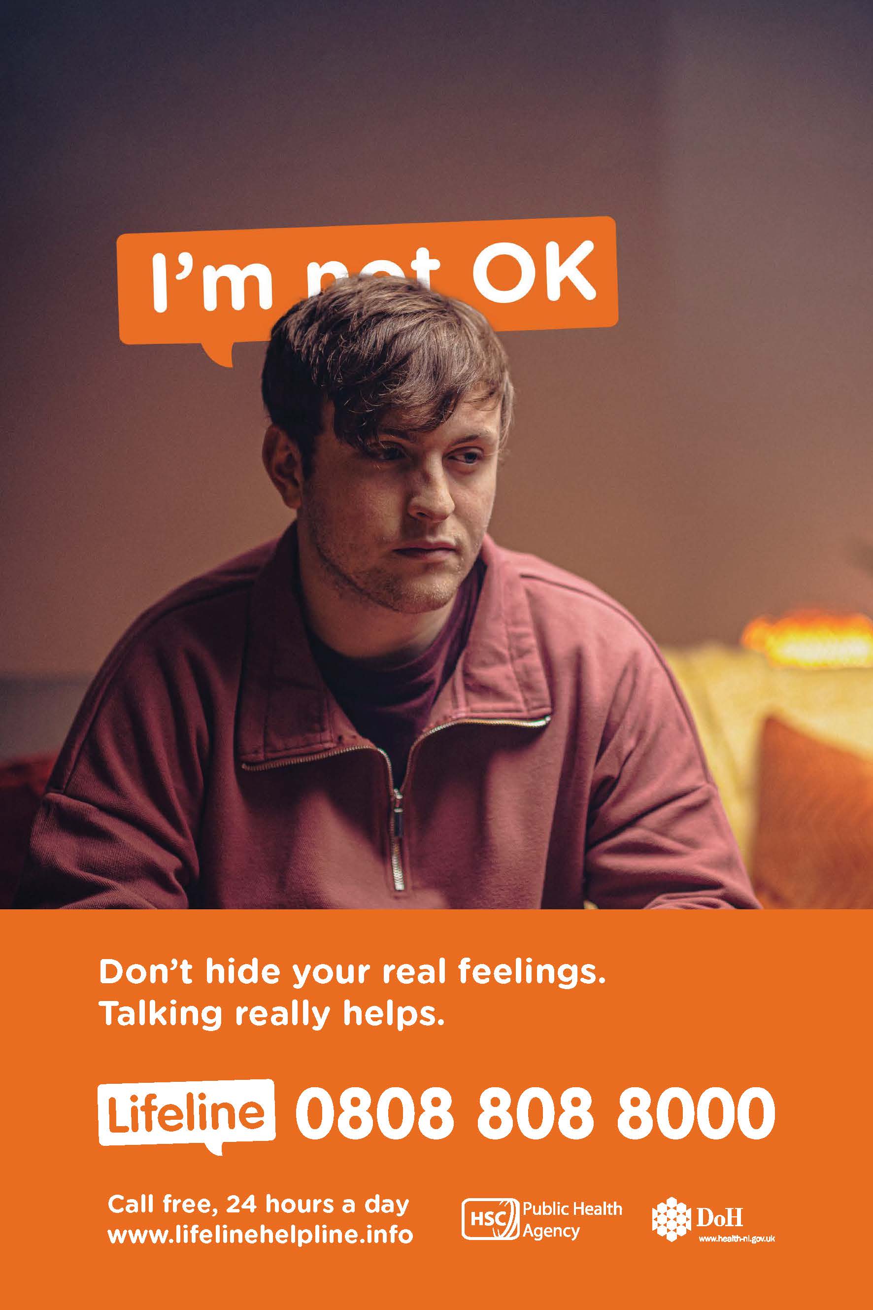 A man with text behind him that says I'm not ok" with the word "not" obscured by the man's head
