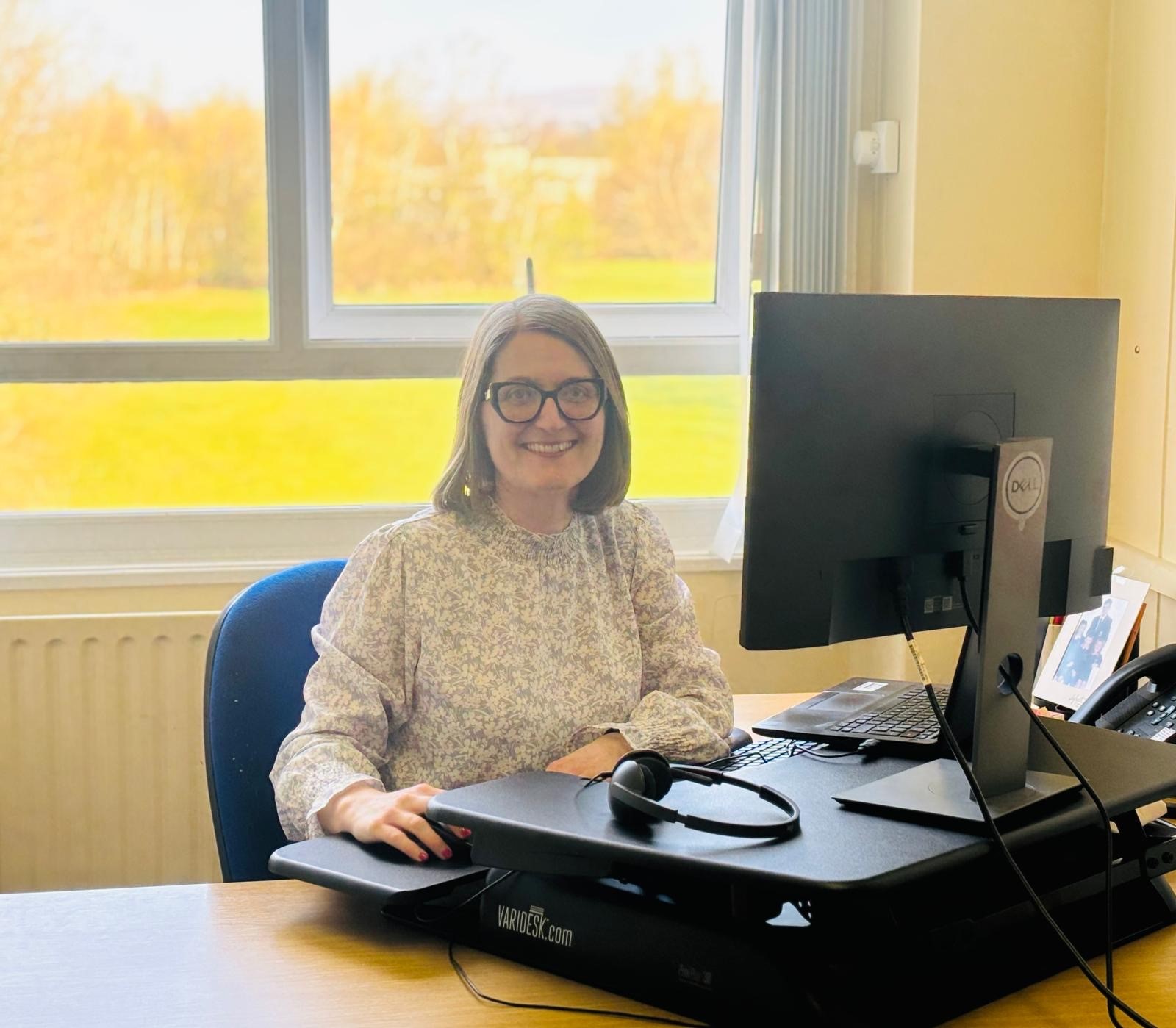 a woman at her desk 