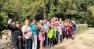 A group of walkers in Tollymore Forest wave or a photo.