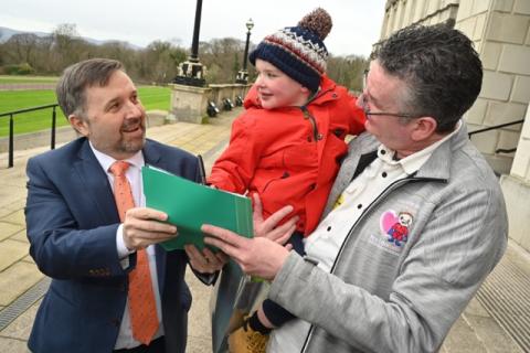 Health Minister Robin Swann with Dáithí Mac Gabhann