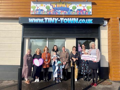 Pictured (L-R) Brona McSorley, Infant Feeding Lead at the Western Trust with Lisa Storey, Child Development Interventions Coordinator at the Western Trust, Claire Hamilton, Health Improvement Officer at the Western Trust, Natalie Hegarty, Aine McIvor, Owner of Tiny Town, Victoria Page, Karen Brown and Dr Hannah McCourt Senior Health and Social Wellbeing Improvement Officer at the Public Health Agency. 