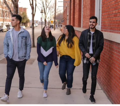 a group of young people walking down the street