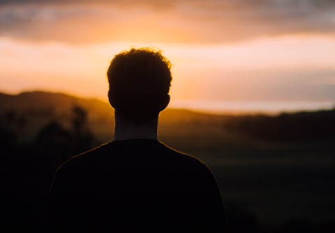 man looking into the horizon
