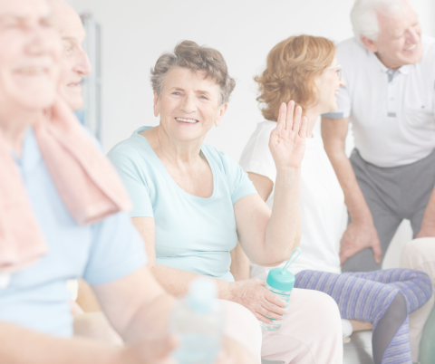 Photograph of older people smiling and laughing together, to promote positive aging month.