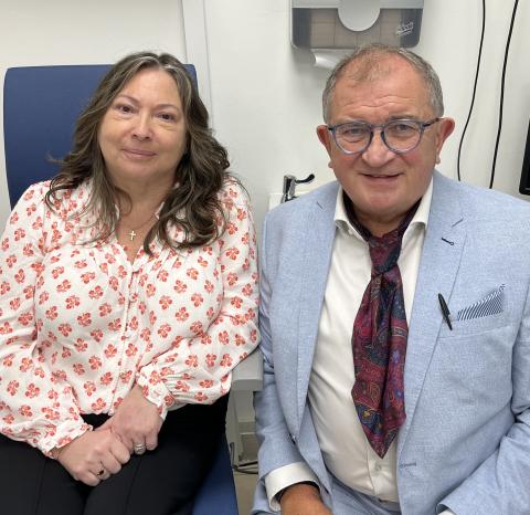 Photograph of Optician Sam Baird, with patient Gail Cairns.
