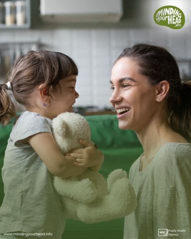 Child and adult talking 