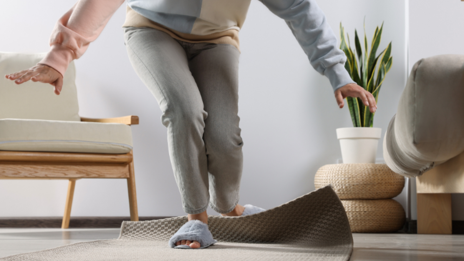 A person is tripping on a rug text says look out for preventable hazards in your home this Christmas. PHA logo and Home Accident Prevention logo 