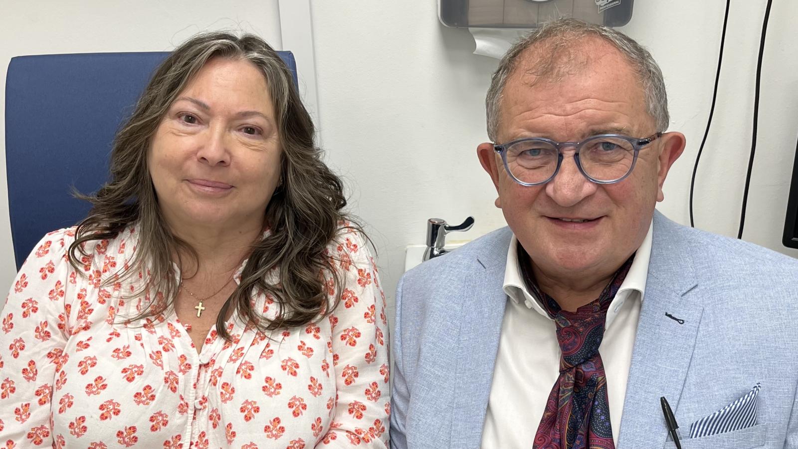 Photograph of Optician Sam Baird, with patient Gail Cairns. 