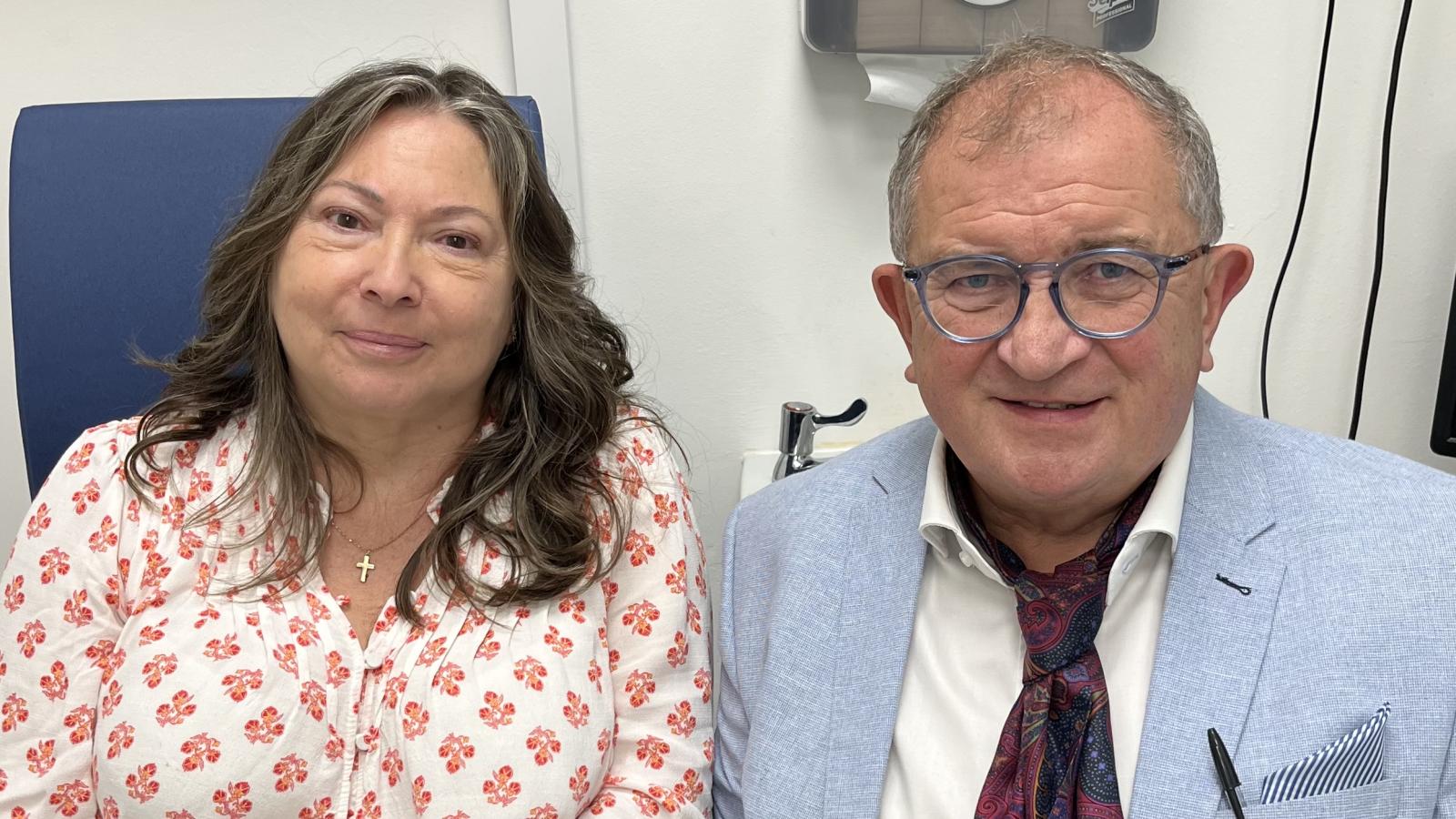 Photograph of Optician Sam Baird, with patient Gail Cairns.