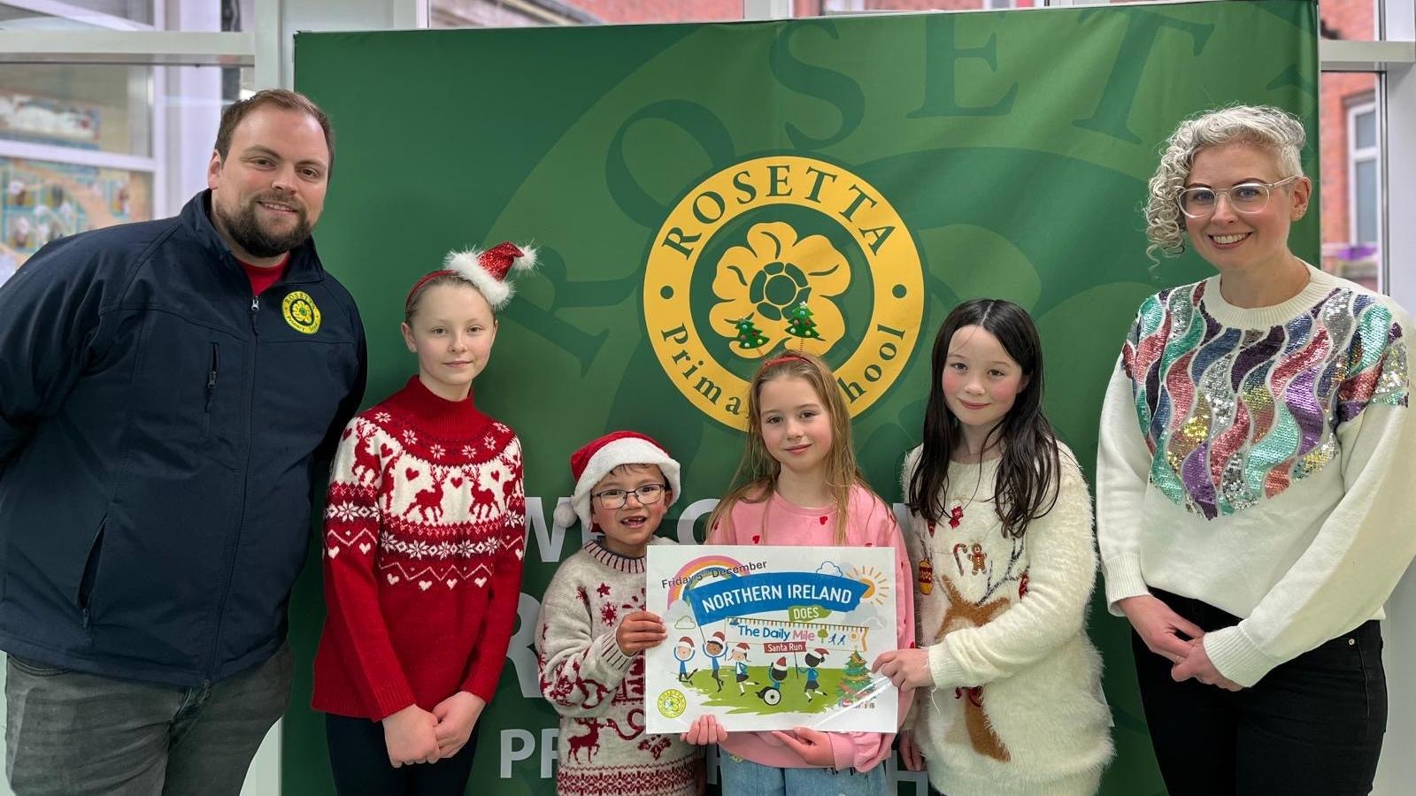 (L-R) Mr McGarrigle, pupils and  Dr Hannah McCourt, PHA