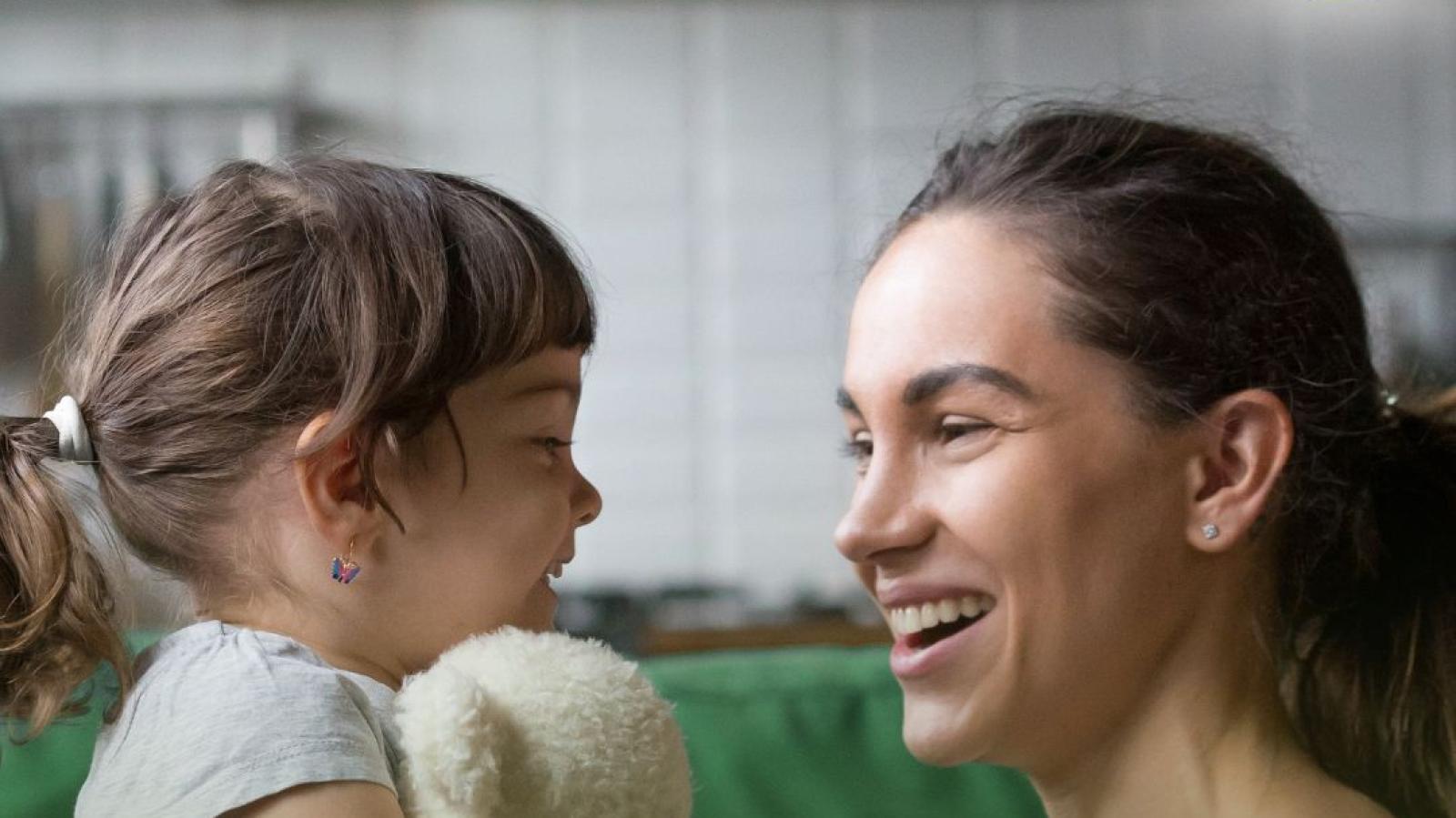 Child and adult talking 