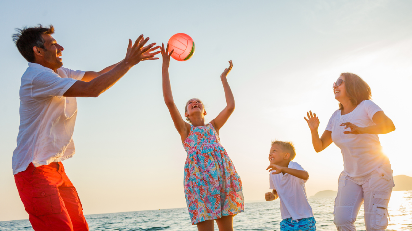 Graphic of family playing on the beach in the sunshine, with text 'hot weather advice'.