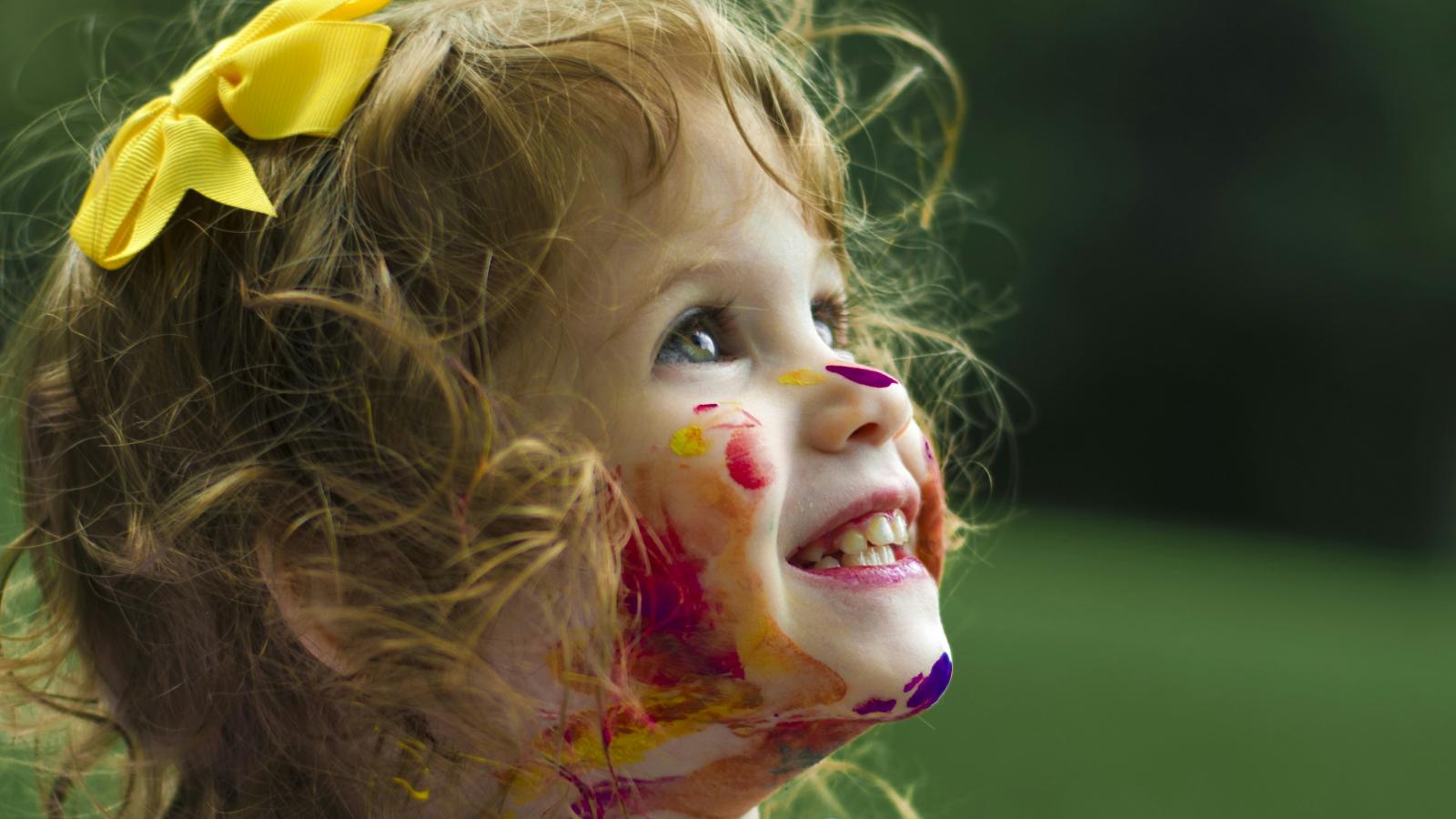 Child covered in paint