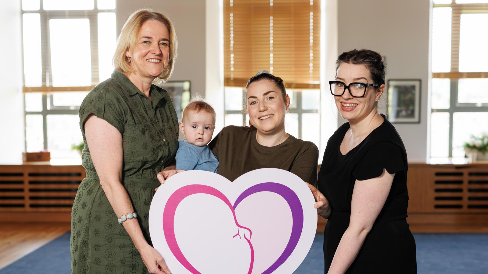 (L-R) Orlaith Moley; PHA, local mum Aimee McIlwaine and baby Brendan, Councillor Rosie Kinnear; Antrim and Newtownabbey Council