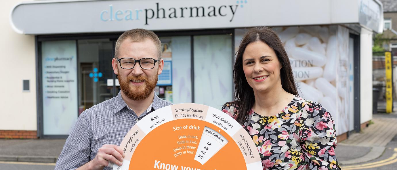 pharmacists holding know your units campaign device 