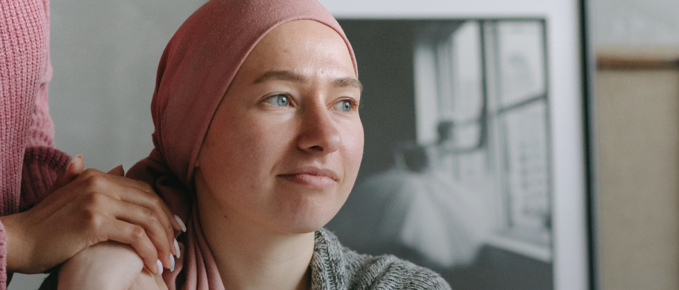 Graphic showing woman with cancer and text "be cancer aware"